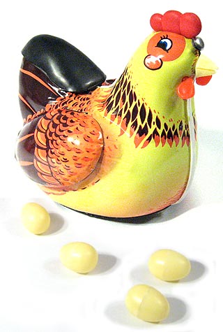hen giving egg